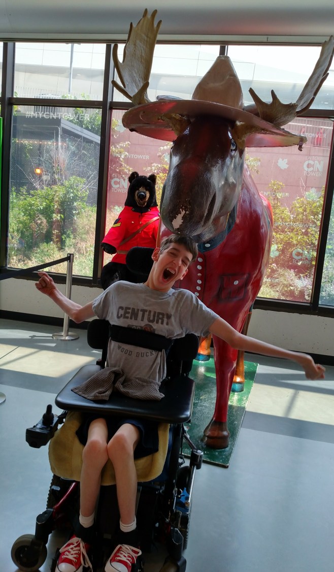 Justin in front of Moose statue