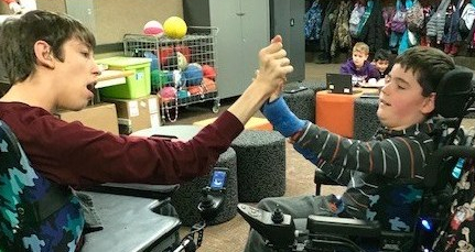 Justin and Roa giving each other high five