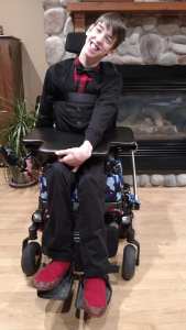 Justin dressed up and smiling