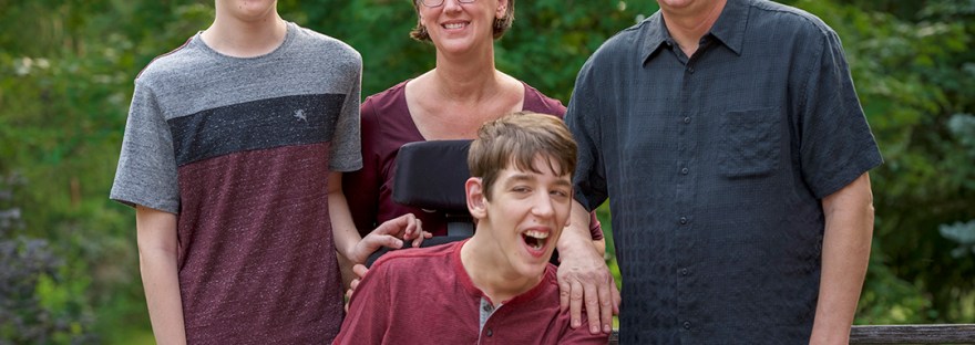 Portrait of Justin, his brother, mom, and dad