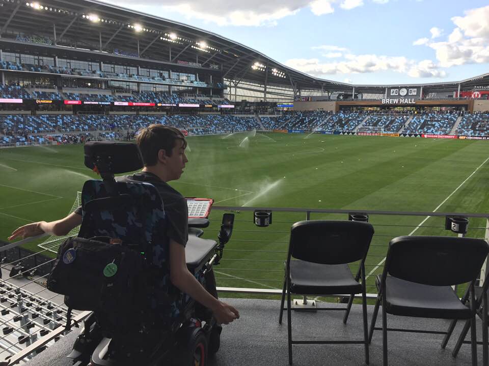Justin in wheelchair looking at the field in Allianz Stadium
