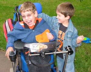 8 year old Justin getting hug from younger brother