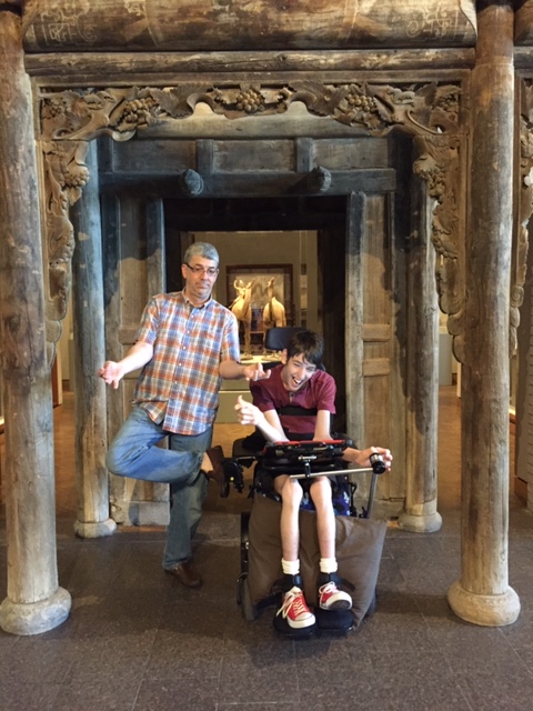 Justin and dad standing in ancient doorway arch