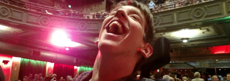 Justin smiling on floor at Palace Theater