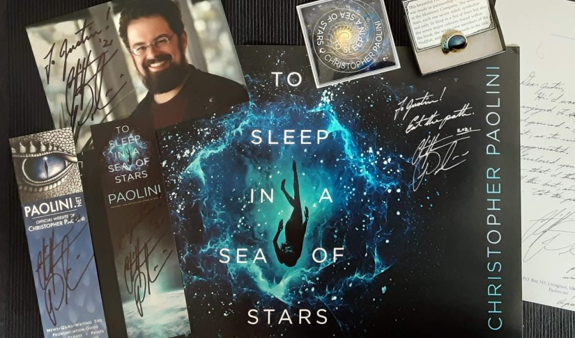 autographed To Sleep in a Sea of Stars poster, bookmarks, letter, photograph of Christopher Paolini