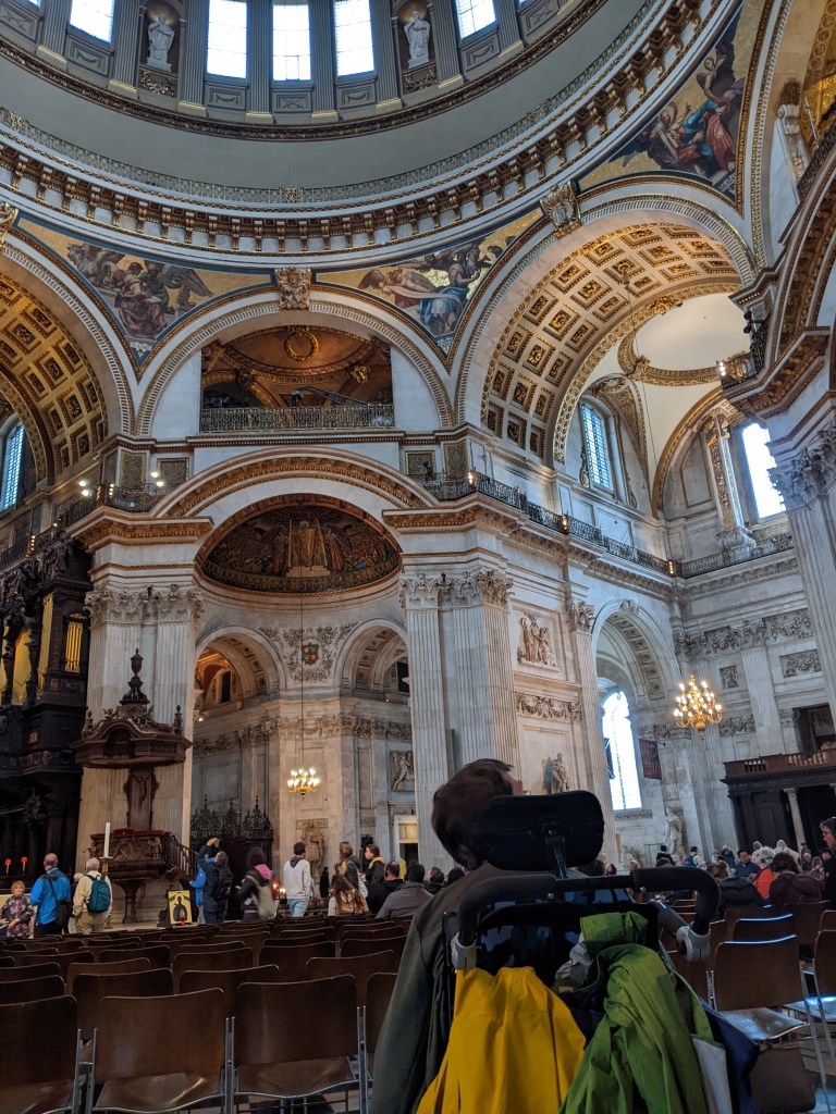 Back of Justin in wheelchair in st. Paul cathedral looking up at dome