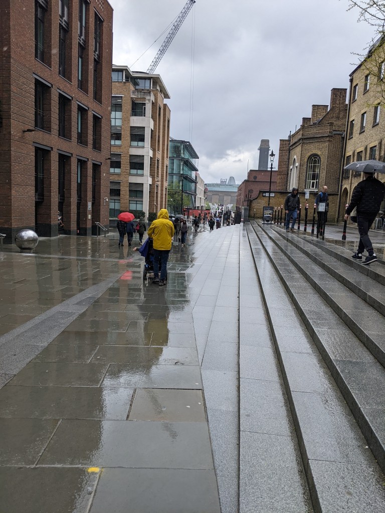 Rainy walk down ramp towards millennium Bridge in london