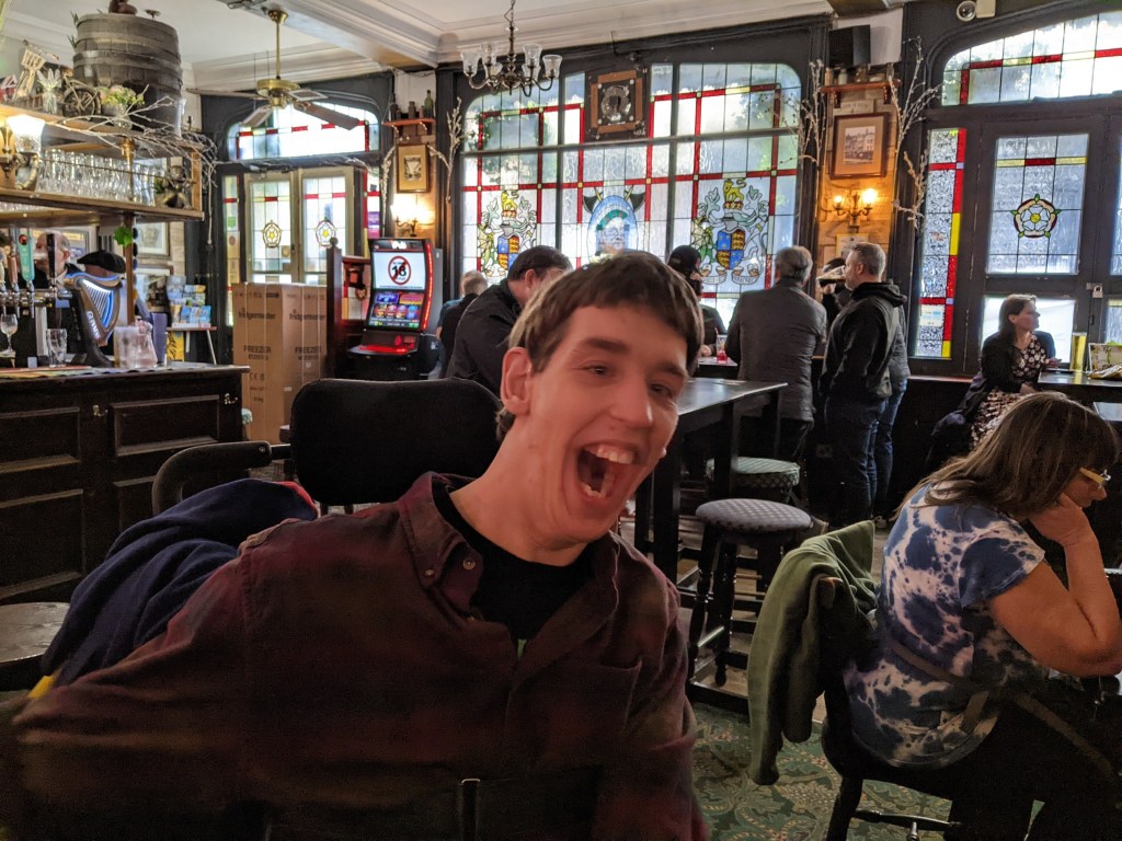 Justin laughing in pub